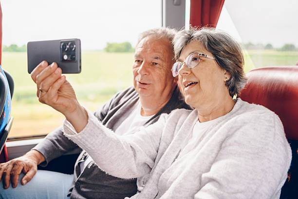 istock Couple using phone in bus. Traveling concept 2219167681