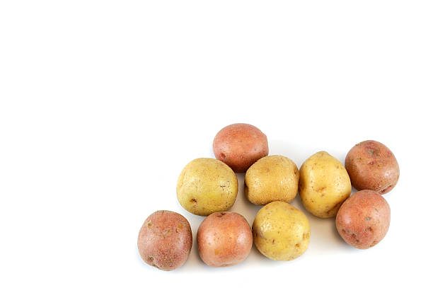 istock Fresh colorful potatoes isolated on white background 2219167737