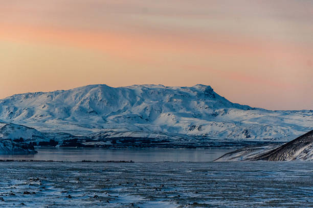 A beautiful winter afternoon in Thingvellir national park in Iceland, with a beautiful setting sun creating golden hour conditions.