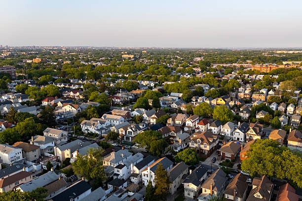 istock Many houses and trees in a cityscape. 2219169159