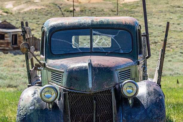 old rusty car in the street close up