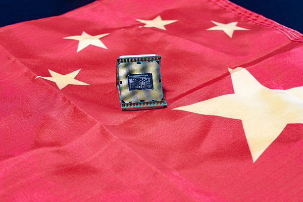 istock A computer chip rests on a Chinese flag, illustrating technological progress and national identity. 2219173644