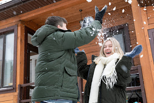 istock A couple laugh and decorate the Christmas tree 2219176233