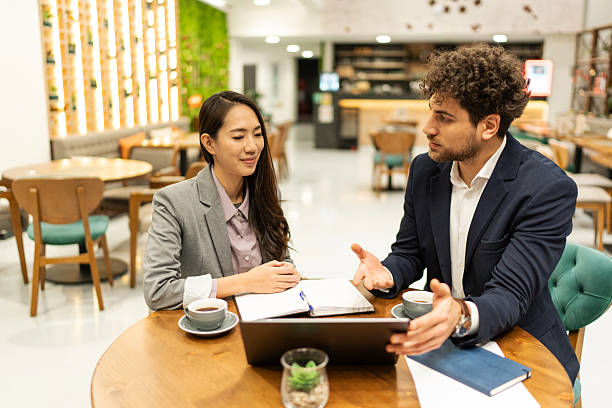 istock Business people discussing work in cafe restaurant meeting 2219177264