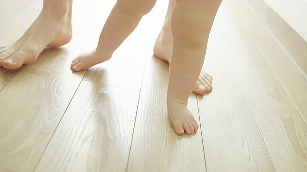 istock Mother teaches baby to walk. 2219178964
