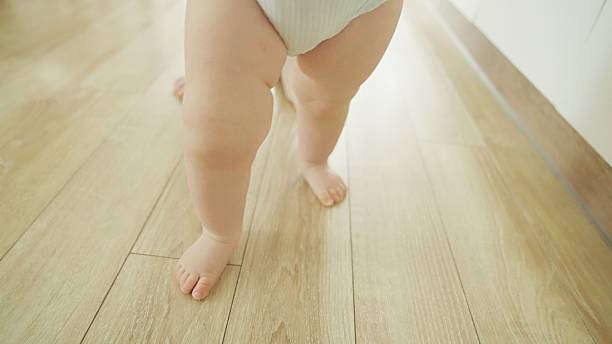 istock Mother teaches baby to walk. 2219178990