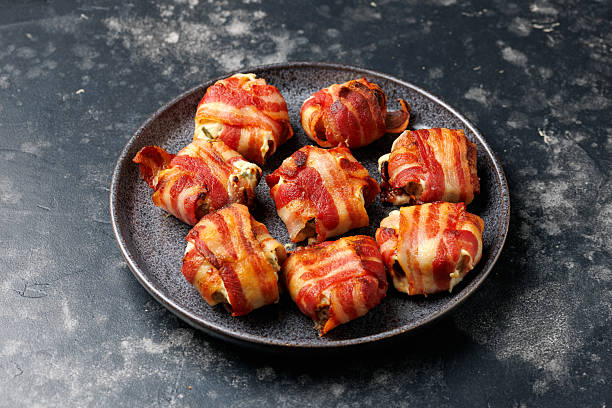 istock Bacon Wrapped Mushrooms stuffed with garlic cream cheese. 2219180447