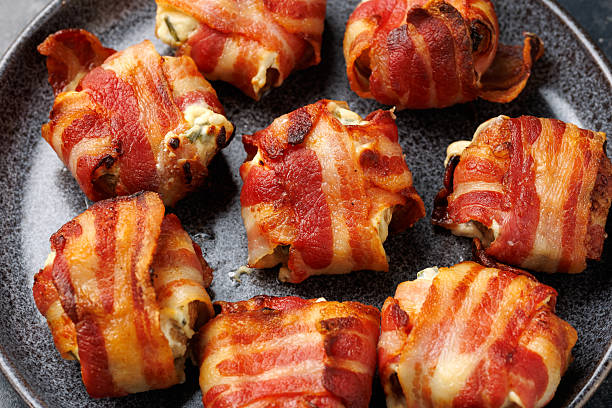 istock Bacon Wrapped Mushrooms stuffed with garlic cream cheese. 2219180450