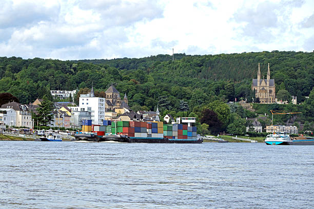 Barges carrying many containers on the Rhine in Germany.