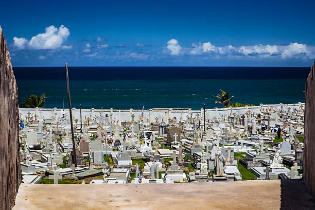 San Juan Puerto Rico Santa María Magdalena de Pazzis Cemetery overlooking the Atlantic Ocean on a bright sunny afternoon.  Cemetery, also known as Old San Juan Cemetery, was originally built in 1863.  Photo date: March 5, 2025.