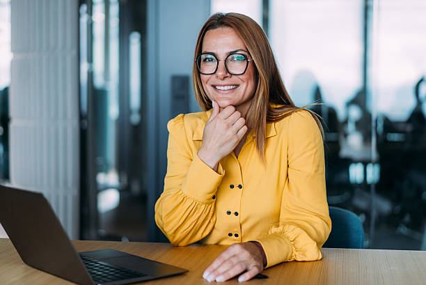 istock Successful businesswoman in modern office working on laptop. 2219186556