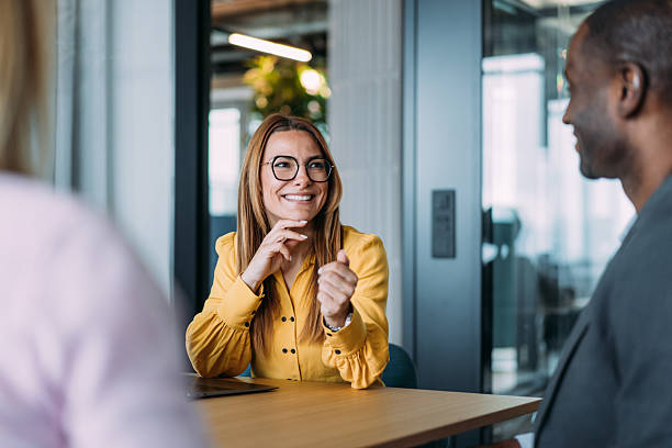 istock Group of business persons talking in the office. 2219186557