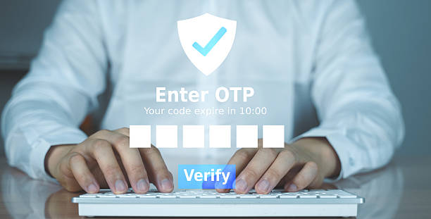 istock Close-up of hands entering a one-time password (OTP) on a virtual login interface. Concept of cybersecurity, online verification, and digital trust. 2219187858