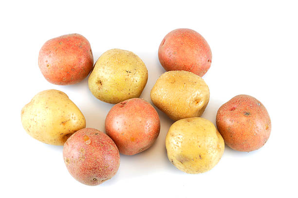 istock Fresh colorful potatoes isolated on white background 2219188662
