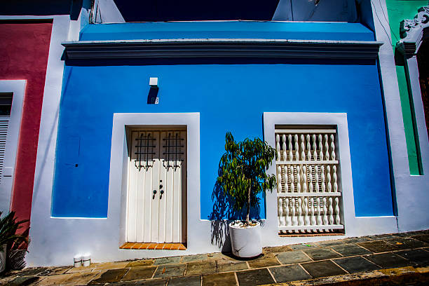 Old San Juan, Puerto Rico doors and windows, old building, lots of character, bright blue, direct sunlight.