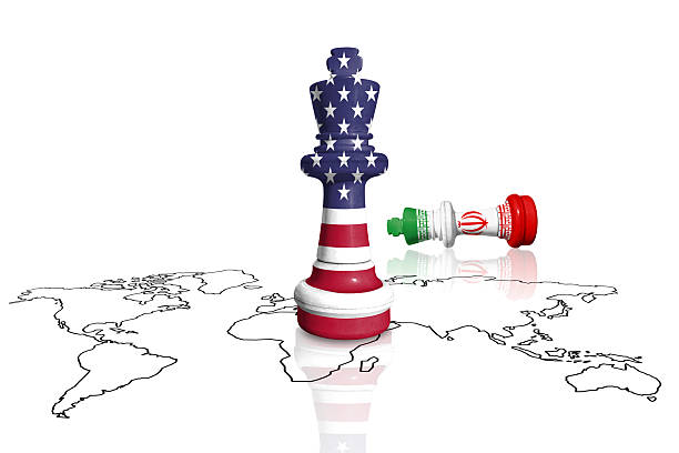 istock Chess made from USA and Iran flags on a world map 2219190183