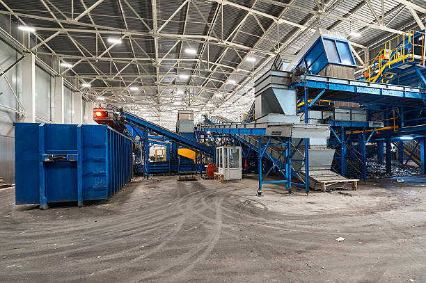 istock Large production line with conveyors carrying trash at plant 2219191861