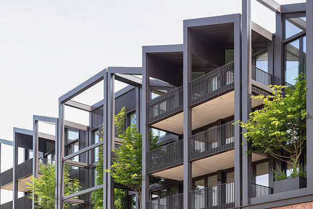 istock Modern apartments with trees in planters between the balconies. 2219196179