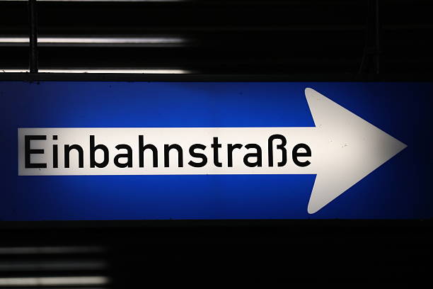 Illuminated sign in a car park at night