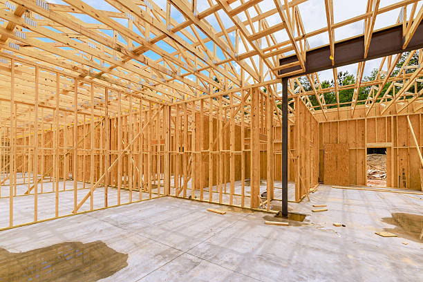 istock Construction process of wooden frame structure in residential area during work day 2219207295