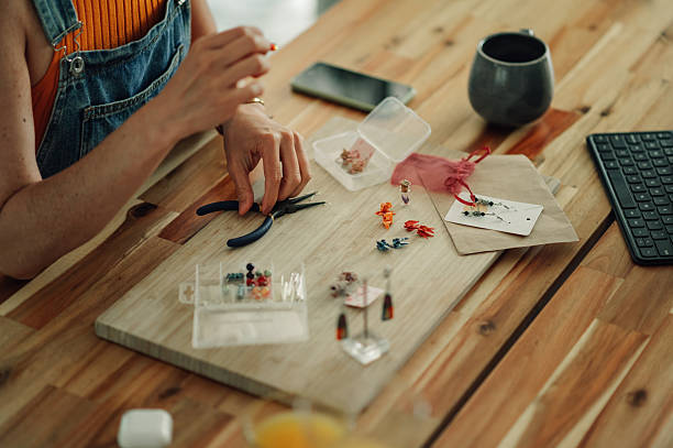 istock Jewelry designer creating handmade earrings in her workshop 2219211530