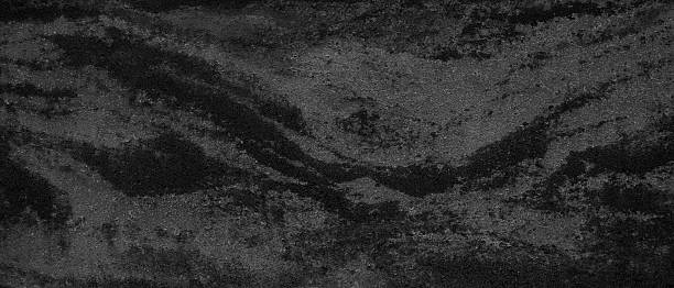 istock Black background with rough stone texture for design of page templates and web banners 2219213614