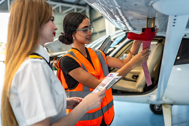 istock Female aviation technicians conducting aircraft maintenance 2219217207