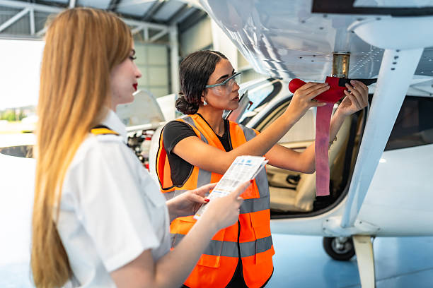 istock Aircraft maintenance engineer inspecting airplane wing with pilot 2219217212