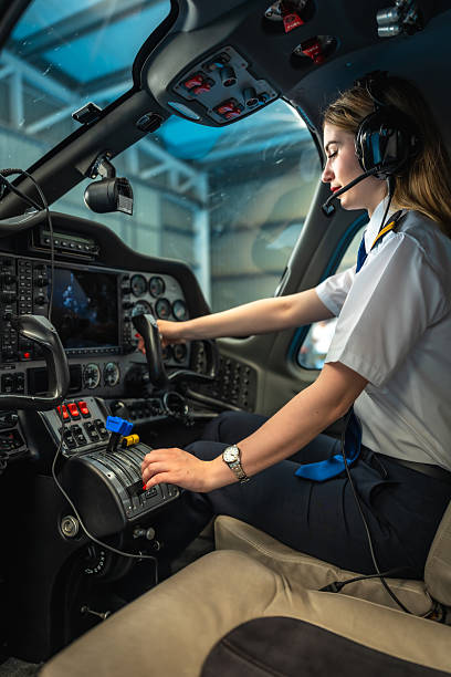 istock Female pilot sitting in cockpit and preparing for takeoff 2219217322