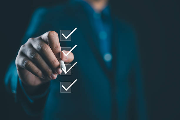 istock Businessman tick correct sign mark for document approve , project acceptance and quality assurance concept, Take an assessment, questionnaire, evaluation, online survey online exam. 2219220258