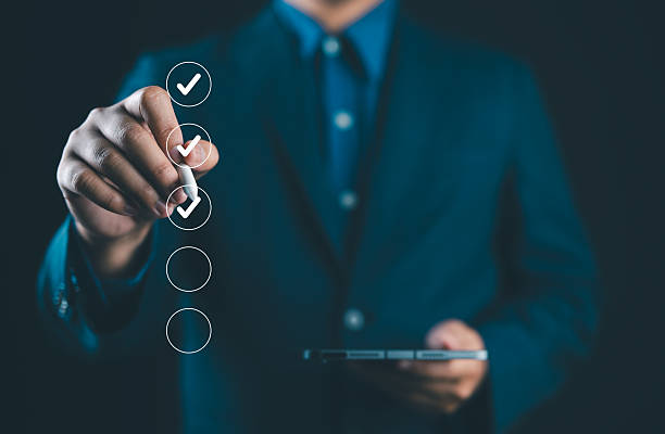 istock Business performance checklist, businessman using smartphone doing online checklist survey, filling out digital form checklist, take an assessment, questionnaire, evaluation, survey, online exam. 2219220260