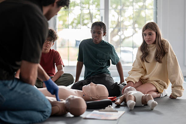 istock Teenagers Learning CPR During First Aid Training Class Indoors 2219220265