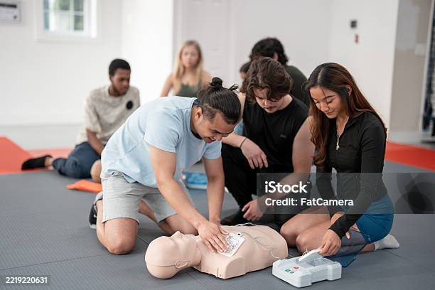 Cpr Group Rack Group Learning Cpr Techniques Using Practice Dummies In A Training ...