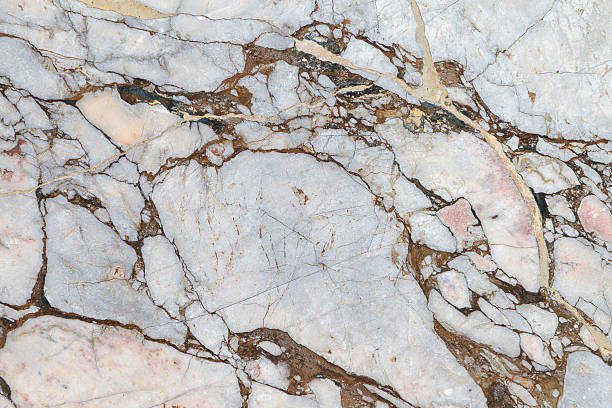 Gray, light beige and rose colored abstract granite background