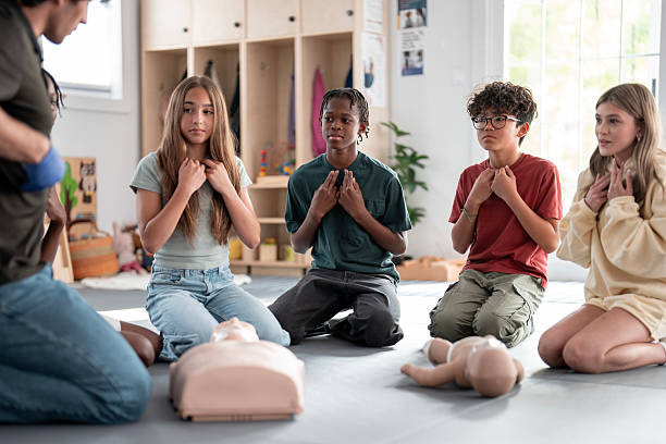 istock Teenagers Practicing CPR in a Classroom During First Aid Training 2219221335
