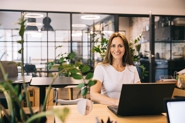istock Professional Woman Posing Confidently in a Modern Office Workspace 2219222040