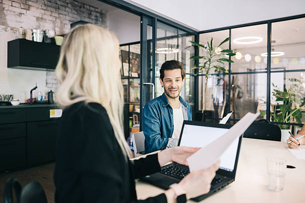 istock Team Collaboration in a Modern Office Environment with Natural Interaction 2219222076