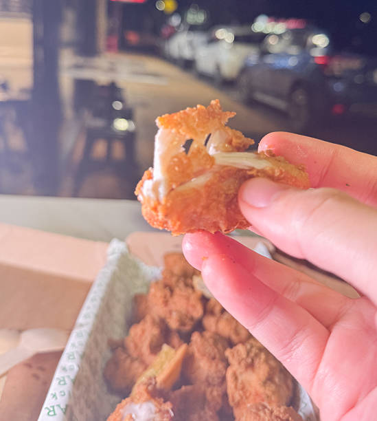 istock Korean deep dried chicken in paper brown take out box 2219223787