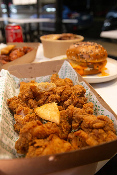 istock Korean deep dried chicken in paper brown take out box 2219223821