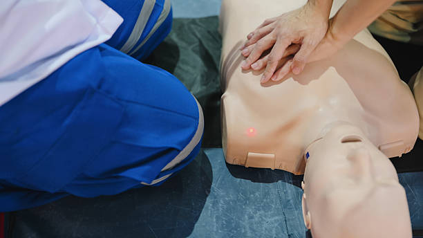 istock first aid demonstration w hands performing cpr chest compressions on training dummy in emergency medical simulation showing lifesaving technique in close-up 2219227455