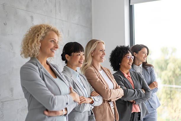 istock Women in Business Attire Promoting Team Unity 2219227607