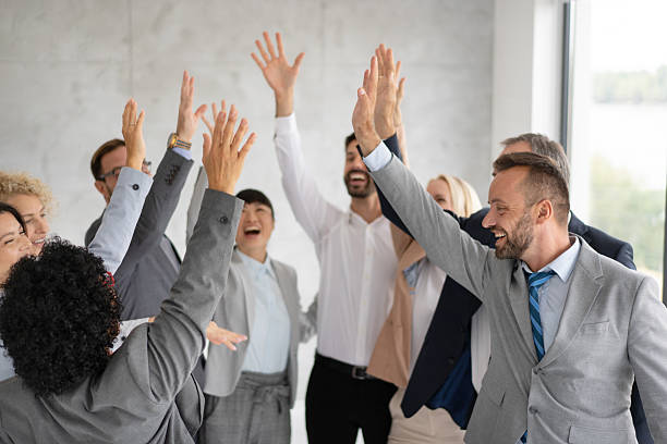 istock Excited Workplace Team Celebrating Group Success Together 2219227618