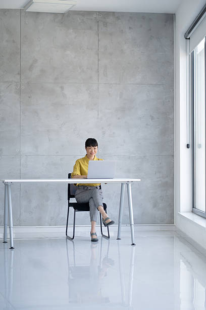 istock Female professional happily working at a bright desk 2219227629