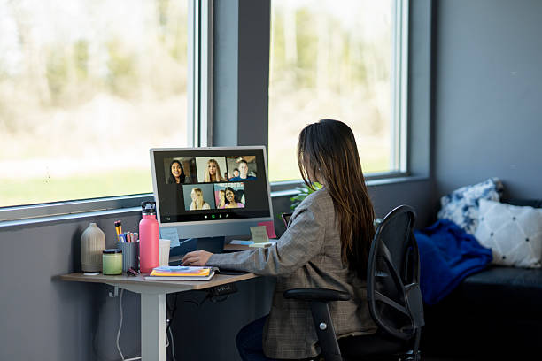 istock Professional Woman Engaged in Video Call with Diverse Participants 2219227983