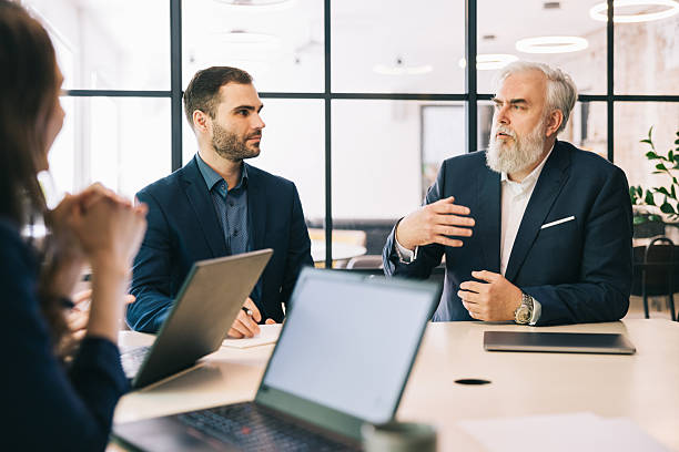 istock Business Professionals Collaborating During a Modern Office Meeting 2219229738