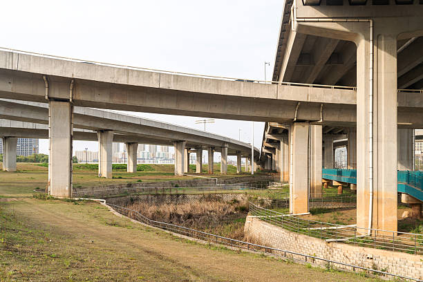 Concrete structure and asphalt road space under the overpass in the city