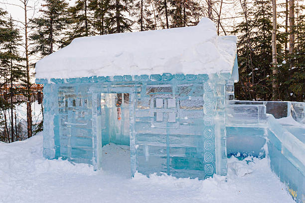 Women working with work tool, cutting ice block, making ice sculpture.