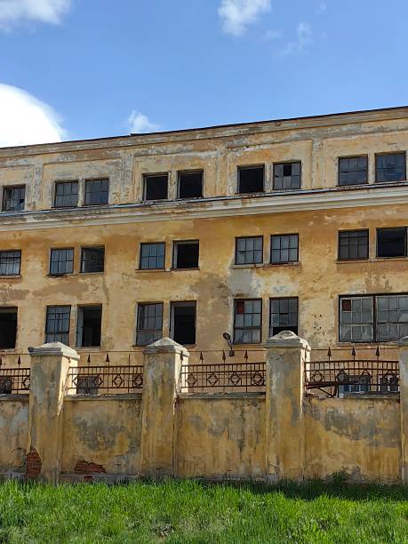 istock abandoned building reveals history with crumbling walls and broken windows in forgotten location. 2219237688