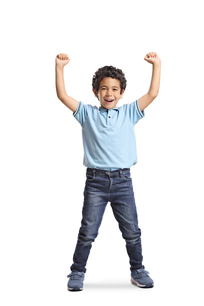 istock Happy boy smiling and raising arms 2219238352