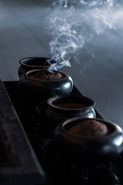Zen Atmosphere with Burning Incense in Temple Vessel